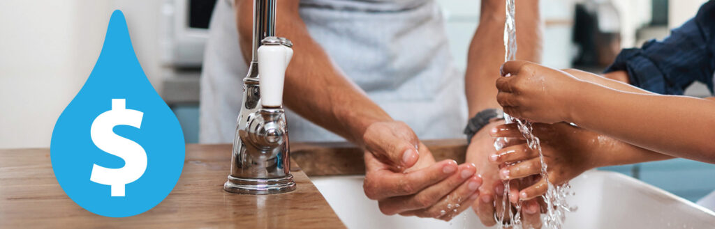 Running water faucet with hands being washed