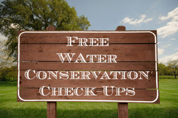 Wooden sign that reads Free Water Conservation Check-Ups